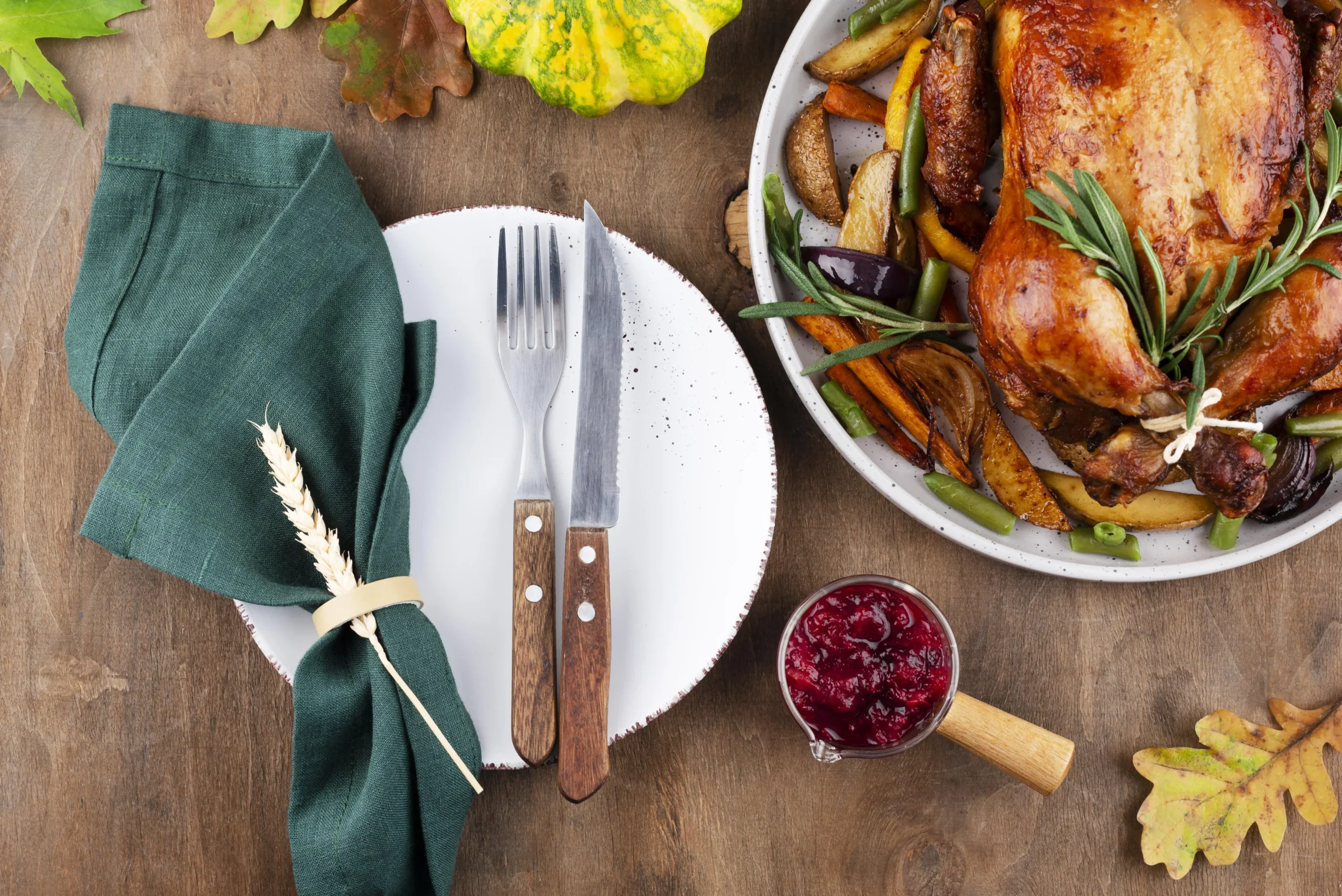 Juicy oven-roasted turkey legs on a rustic wooden platter with herbs and vegetables